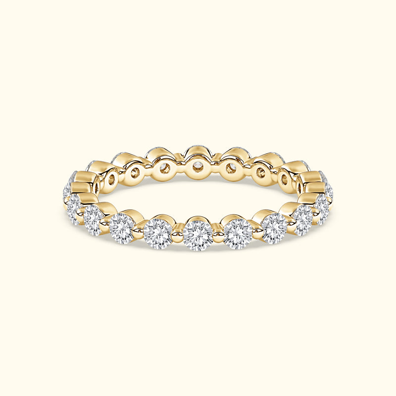 Gold band ring adorned with sparkling round diamonds.