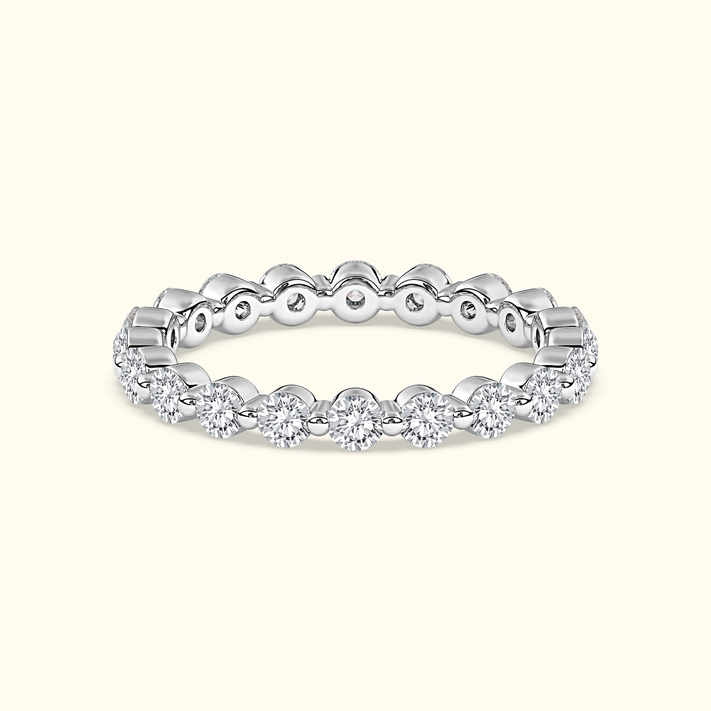Elegant silver ring adorned with sparkling diamonds around the band.