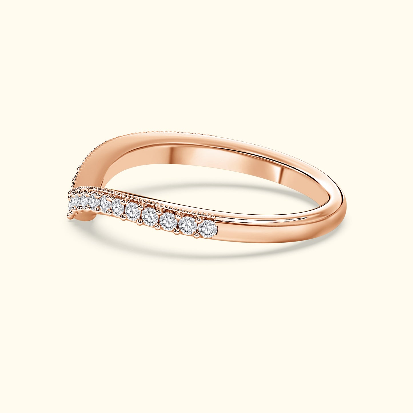 Rose gold ring with a diagonal row of small diamonds.