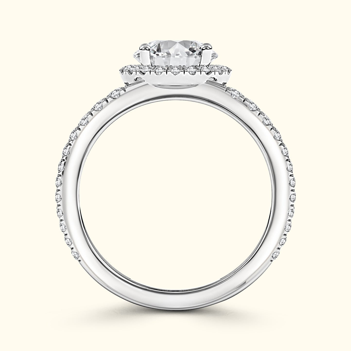 Elegant silver engagement ring featuring a round diamond with a halo of smaller diamonds.