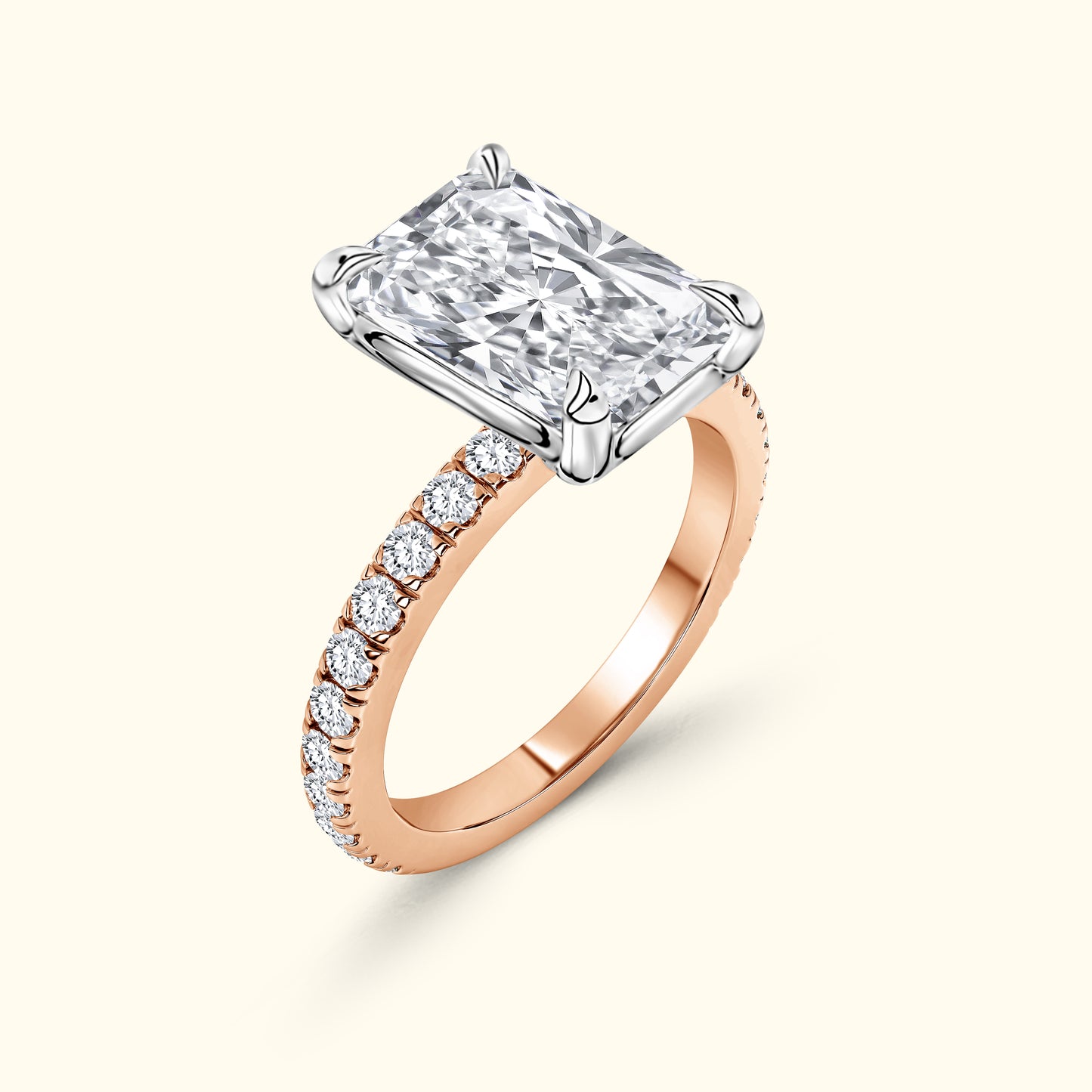 Rose gold ring featuring a large rectangular diamond and a band adorned with smaller diamonds.
