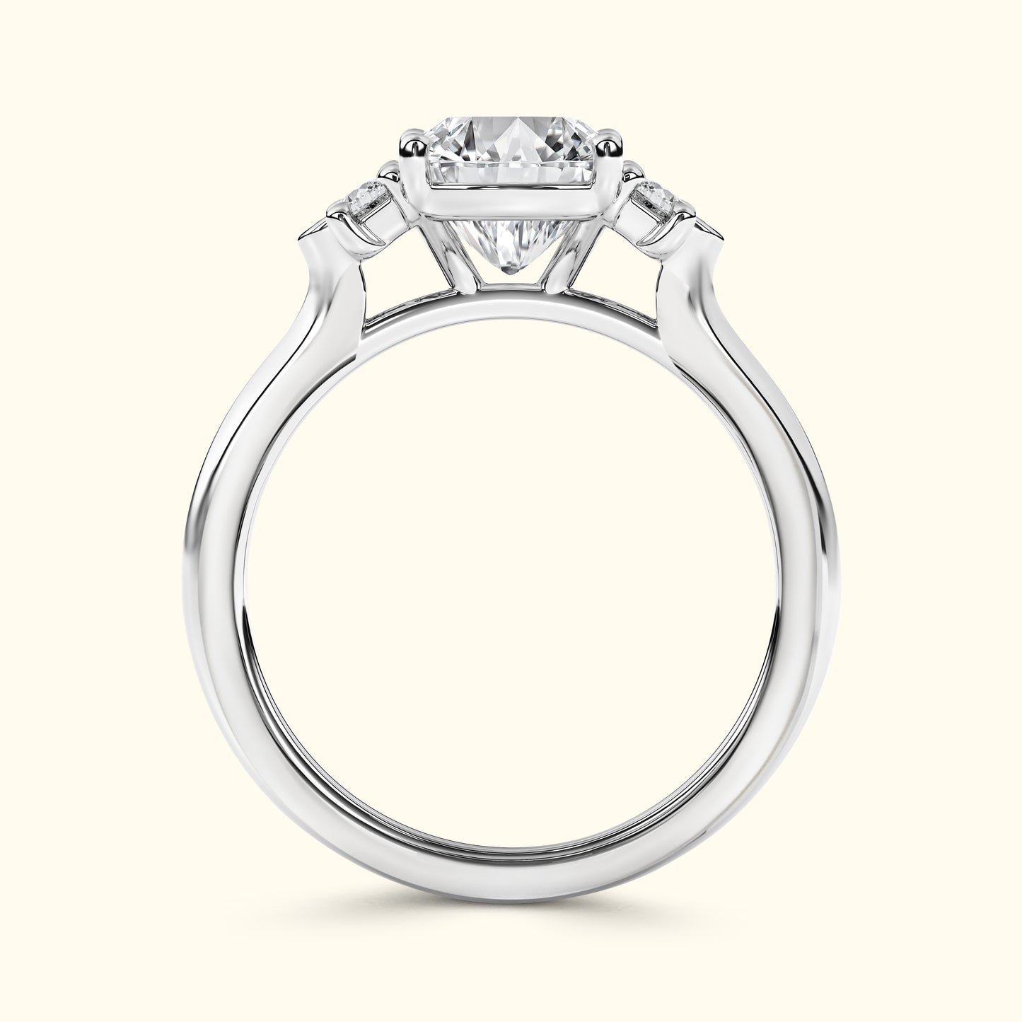 Elegant white gold engagement ring featuring a large center diamond and two smaller side stones.