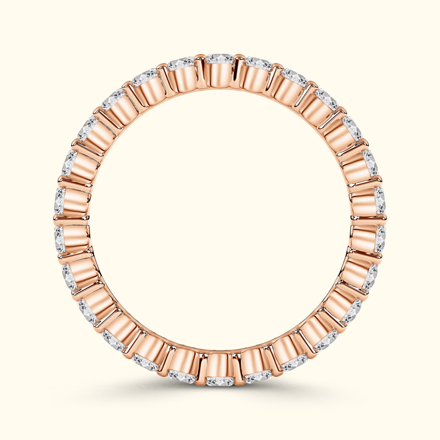 Rose gold band with alternating diamond and gold accents, elegantly circular.
