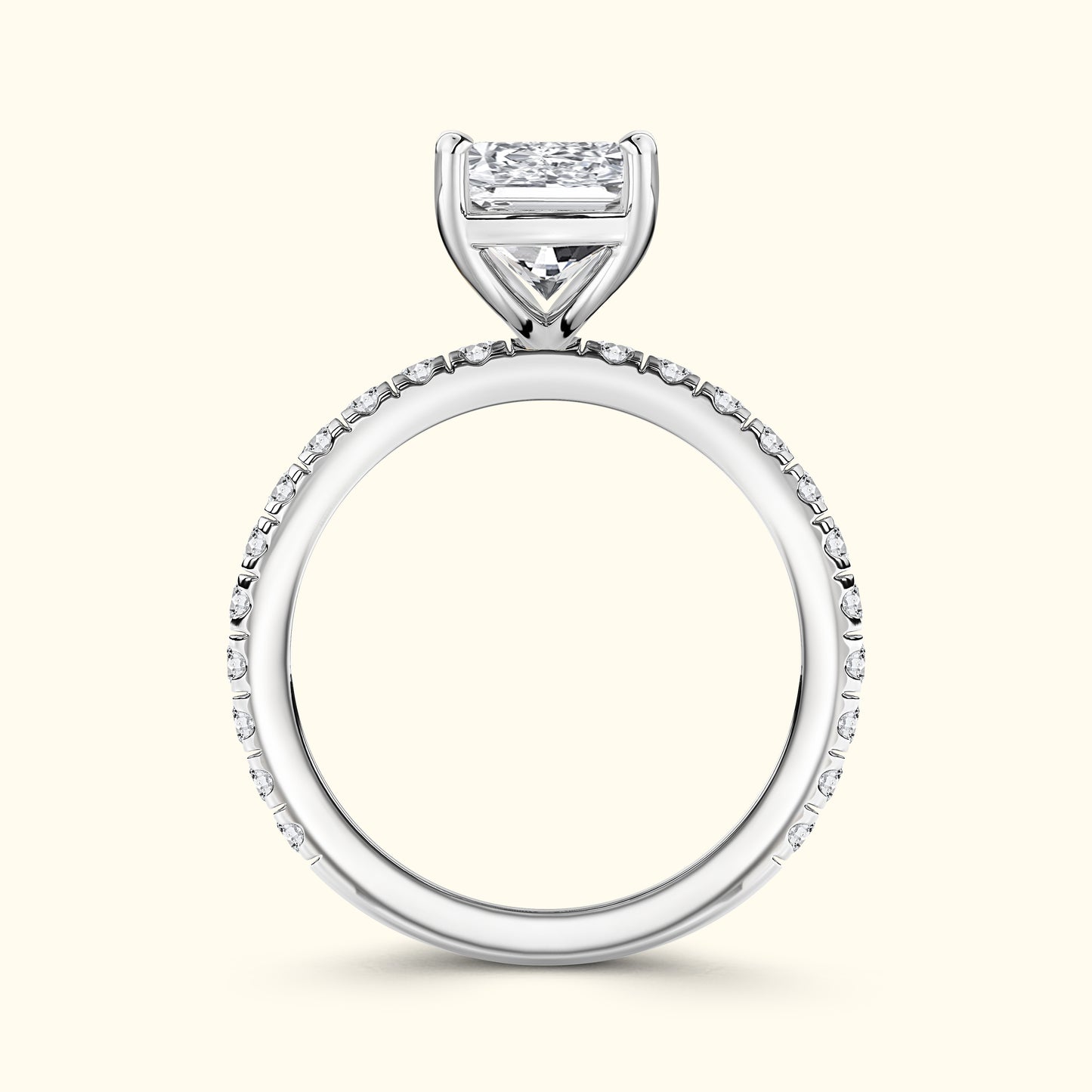 Elegant white gold engagement ring featuring a large diamond and smaller stones on the band.