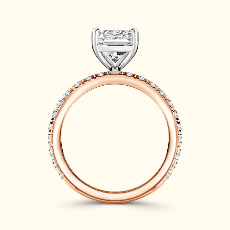 Elegant rose gold and white gold engagement ring with a square diamond centerpiece.