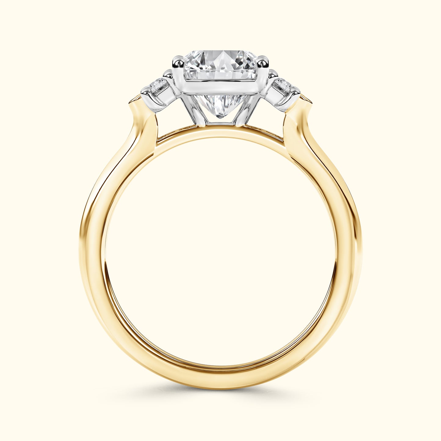 A gold and silver engagement ring featuring a large diamond center stone flanked by smaller diamonds.