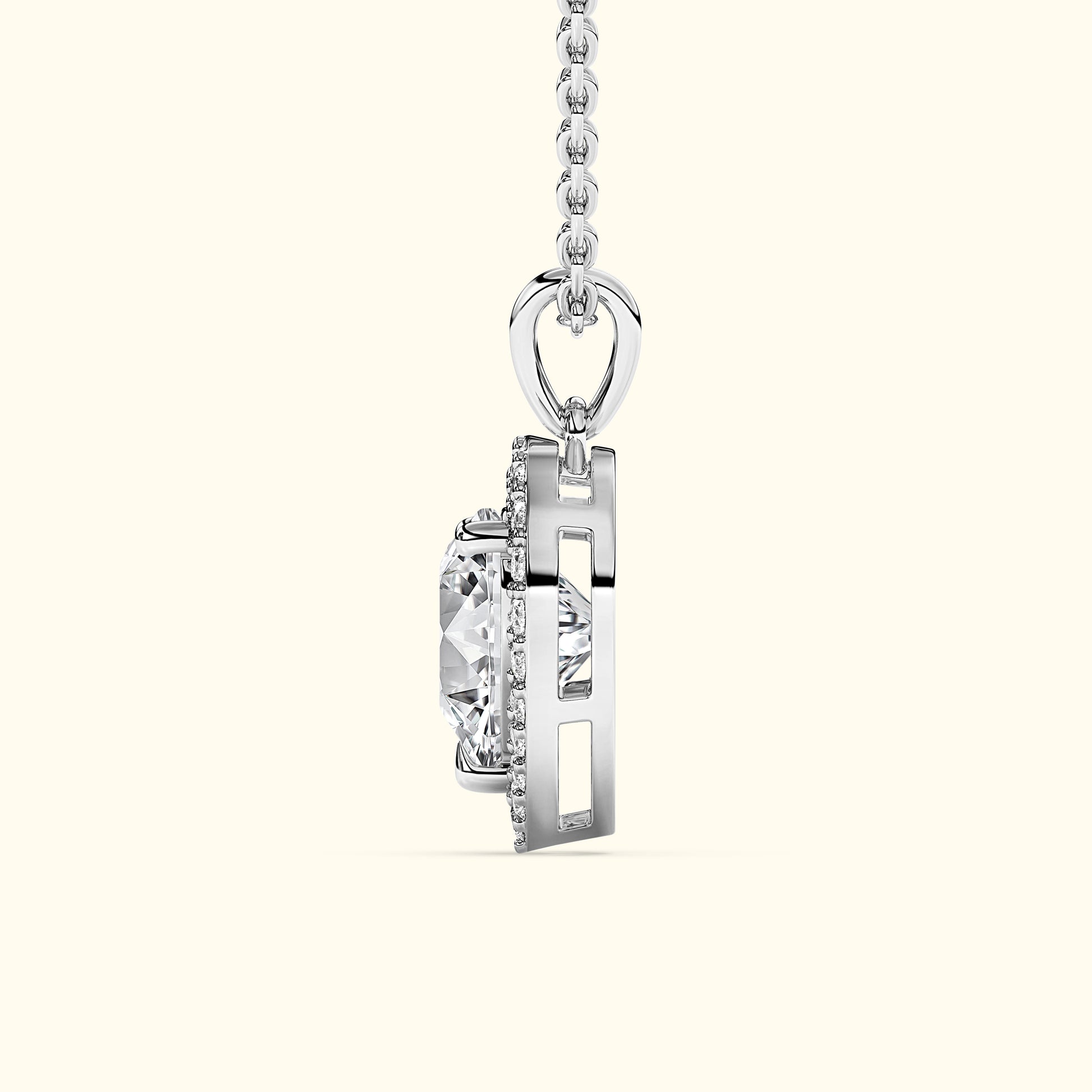 Silver pendant featuring a large clear diamond, suspended from a delicate chain.
