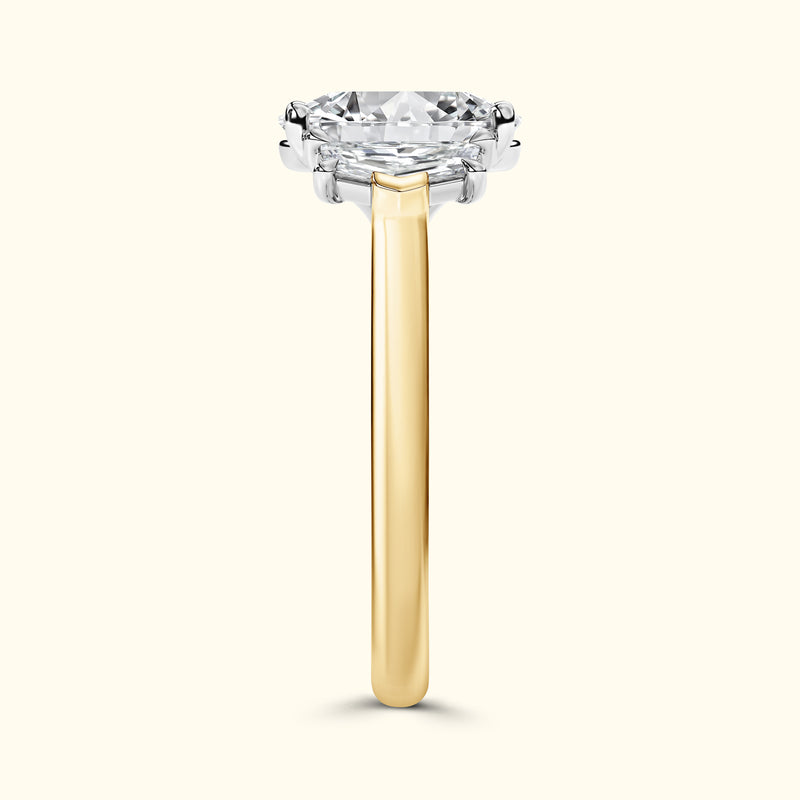 Brilliant solitaire ring with a large round diamond set in a sleek yellow gold band.