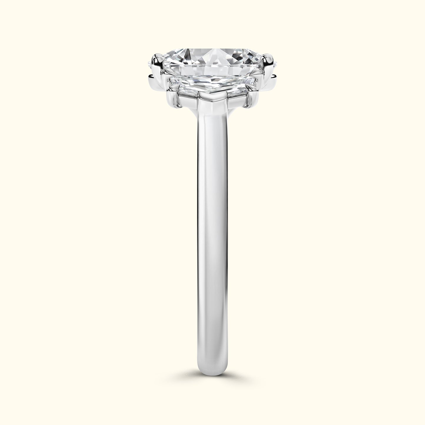 Solitaire diamond ring with a sleek band and a prong-set round diamond on top.