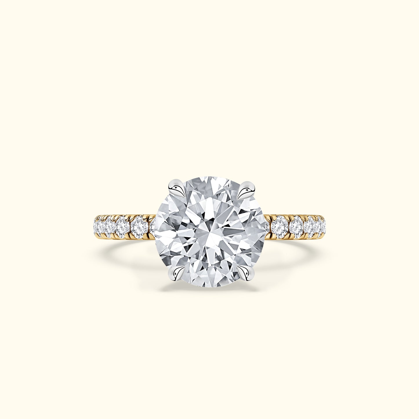 Solitaire diamond ring with a round diamond center and a delicate gold band.