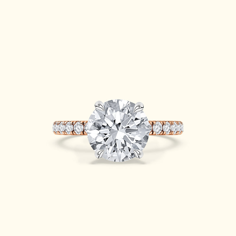 Elegant diamond engagement ring with a large central stone and smaller accent diamonds.