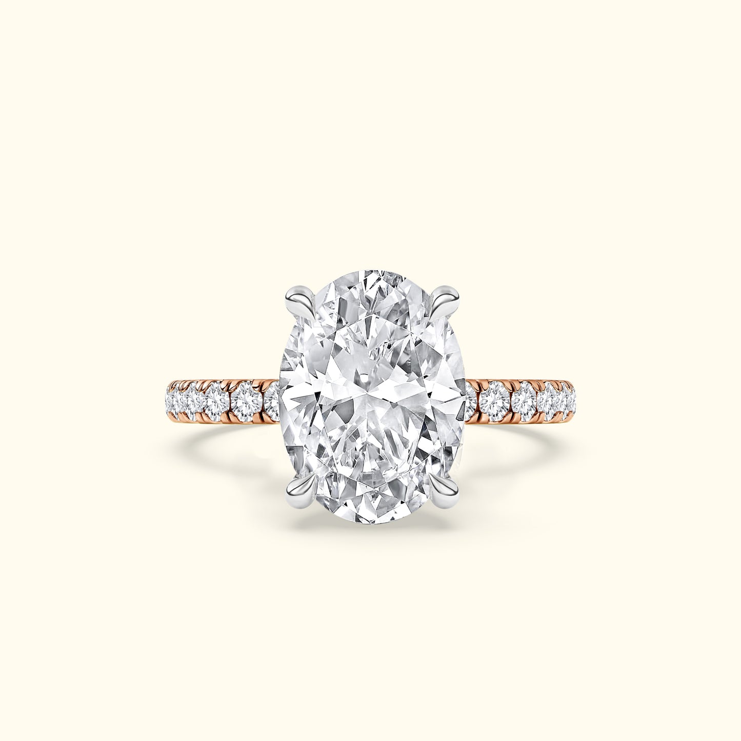 Elegant oval diamond ring with a rose gold band and smaller diamonds accenting the sides.