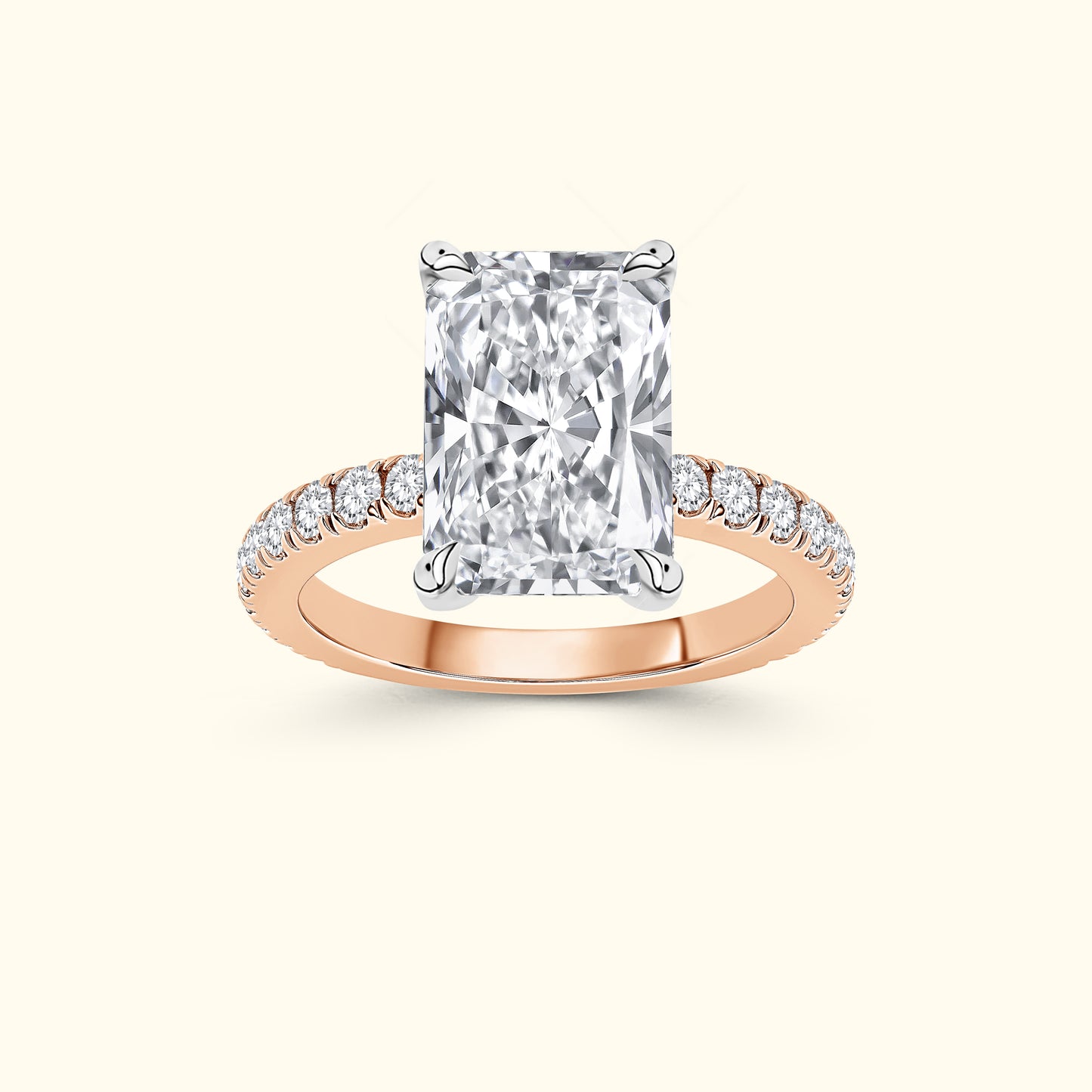 Rectangular diamond ring with small side diamonds on a rose gold band.