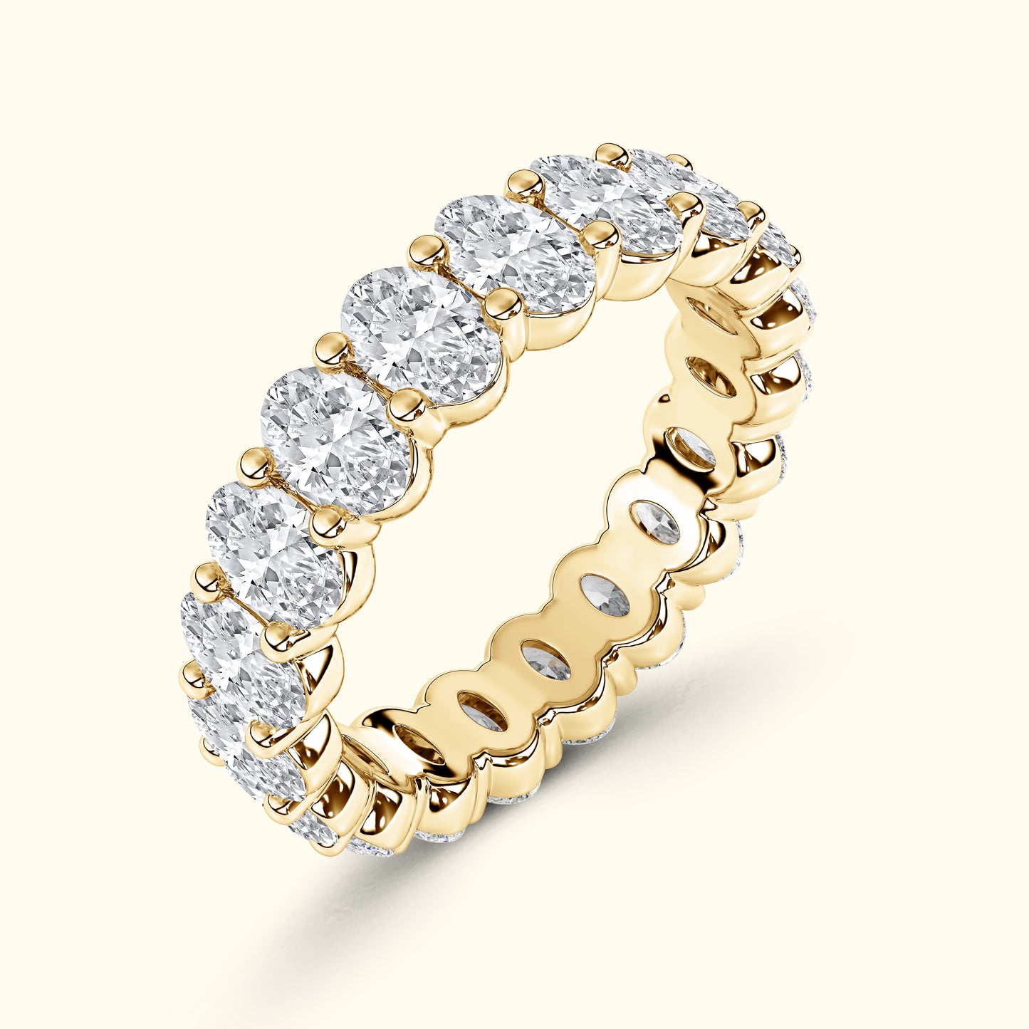 Gold band ring featuring multiple sparkling round diamonds.