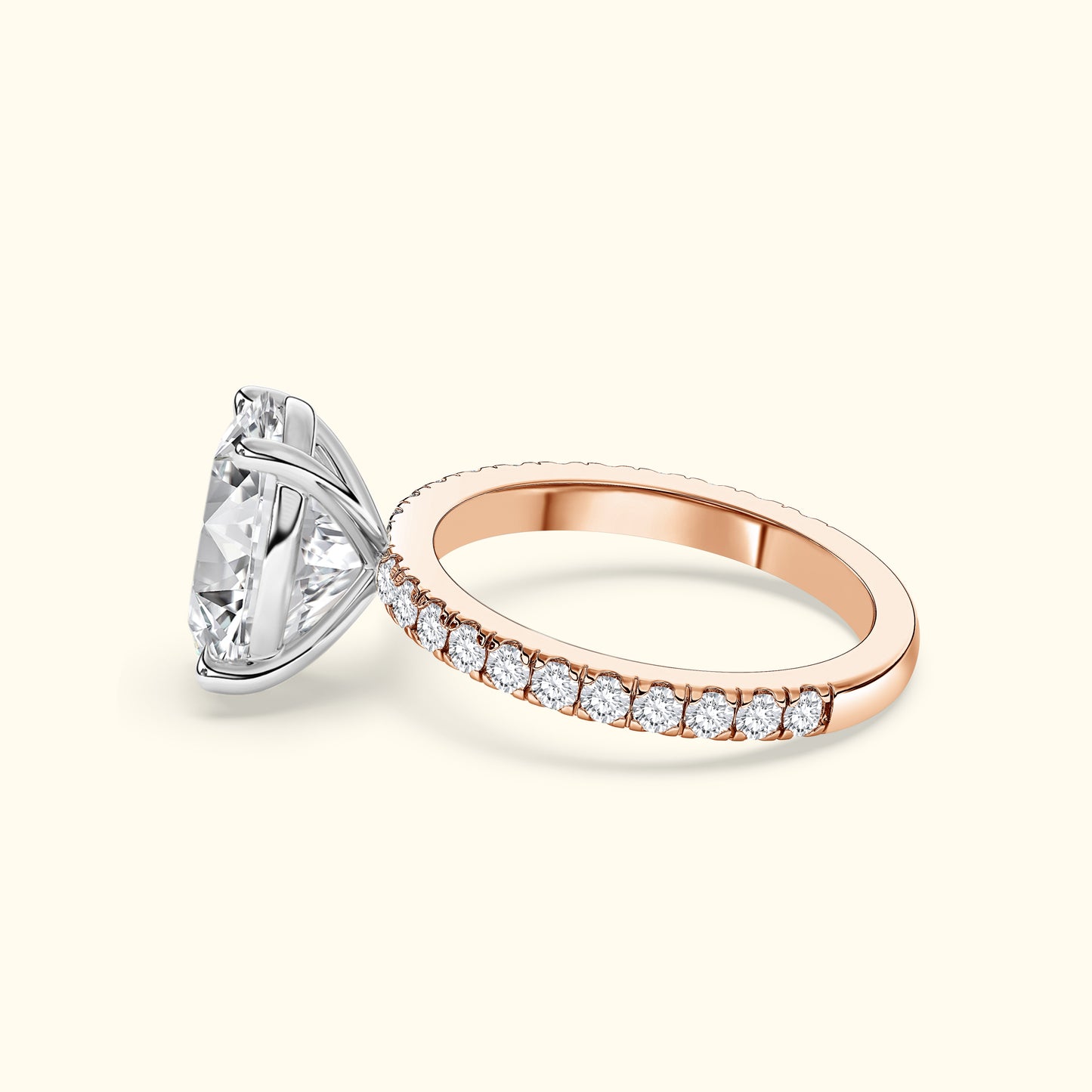 A rose gold engagement ring with a large center diamond and smaller stones on the band.