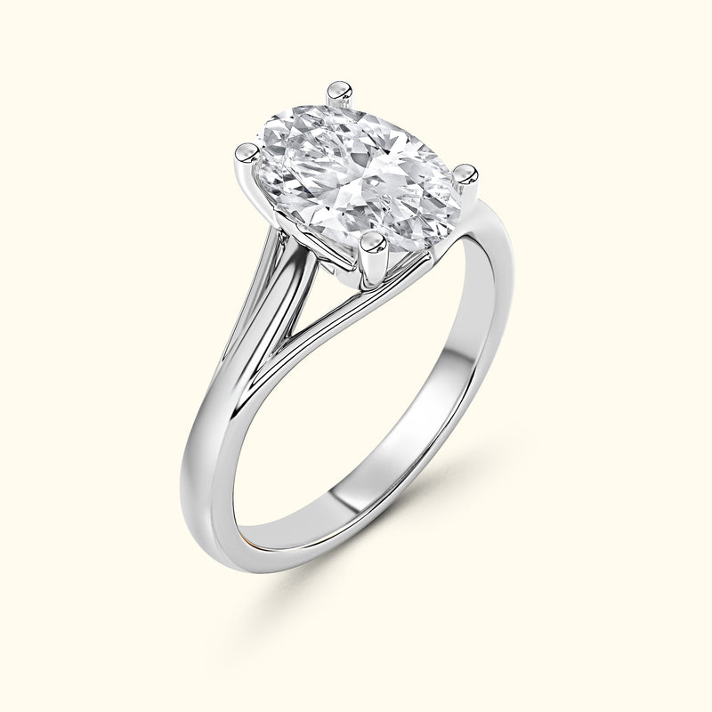 Oval diamond engagement ring set in a polished white gold band.