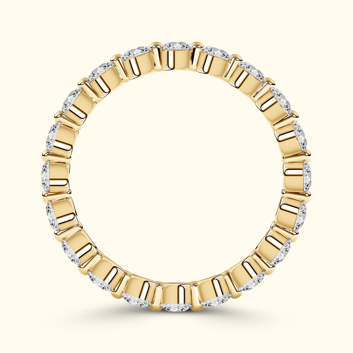 Gold band ring adorned with alternating diamond-cut stones.
