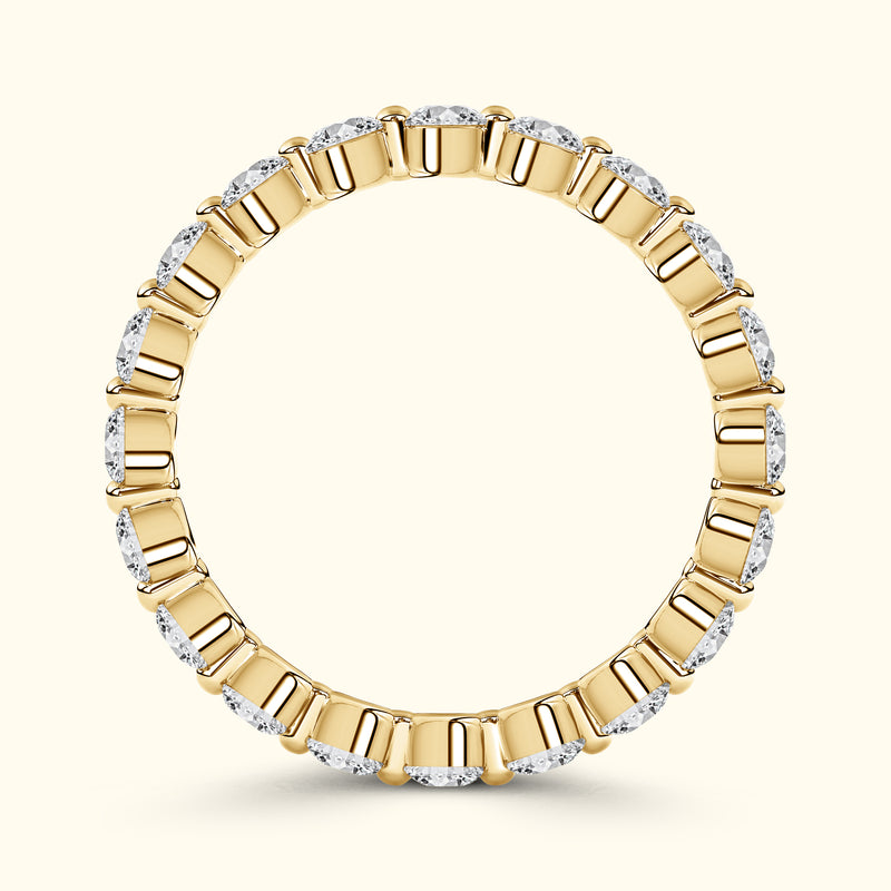 Gold band ring adorned with alternating diamond-cut stones.