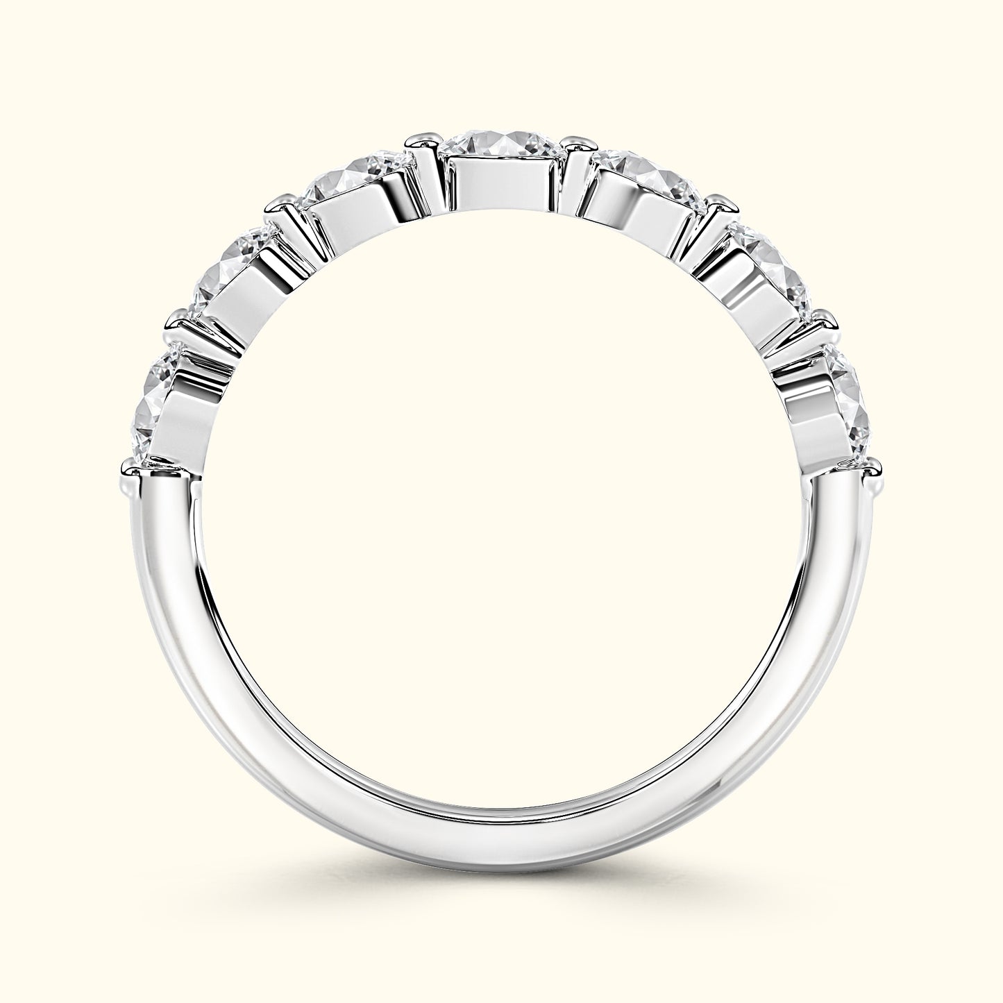 Elegant silver ring with a row of sparkling diamonds set in a curved band.