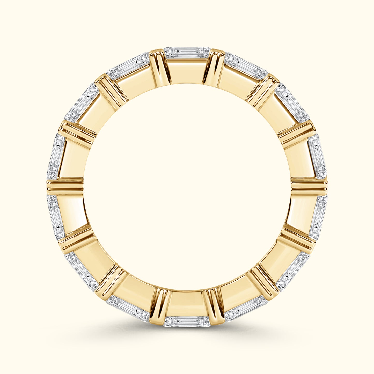 Yellow gold band with alternating baguette-cut diamonds.