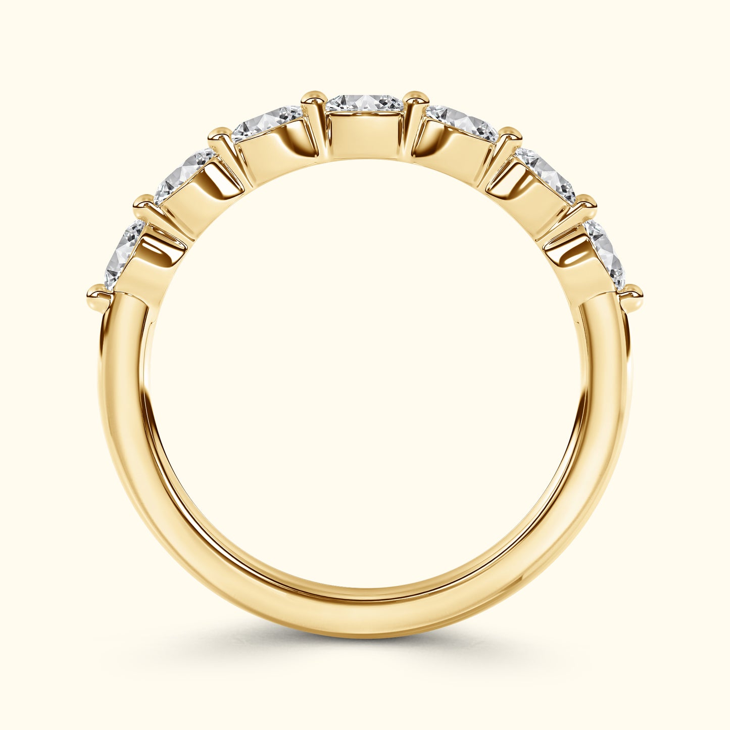Gold band ring set with multiple sparkling diamonds.
