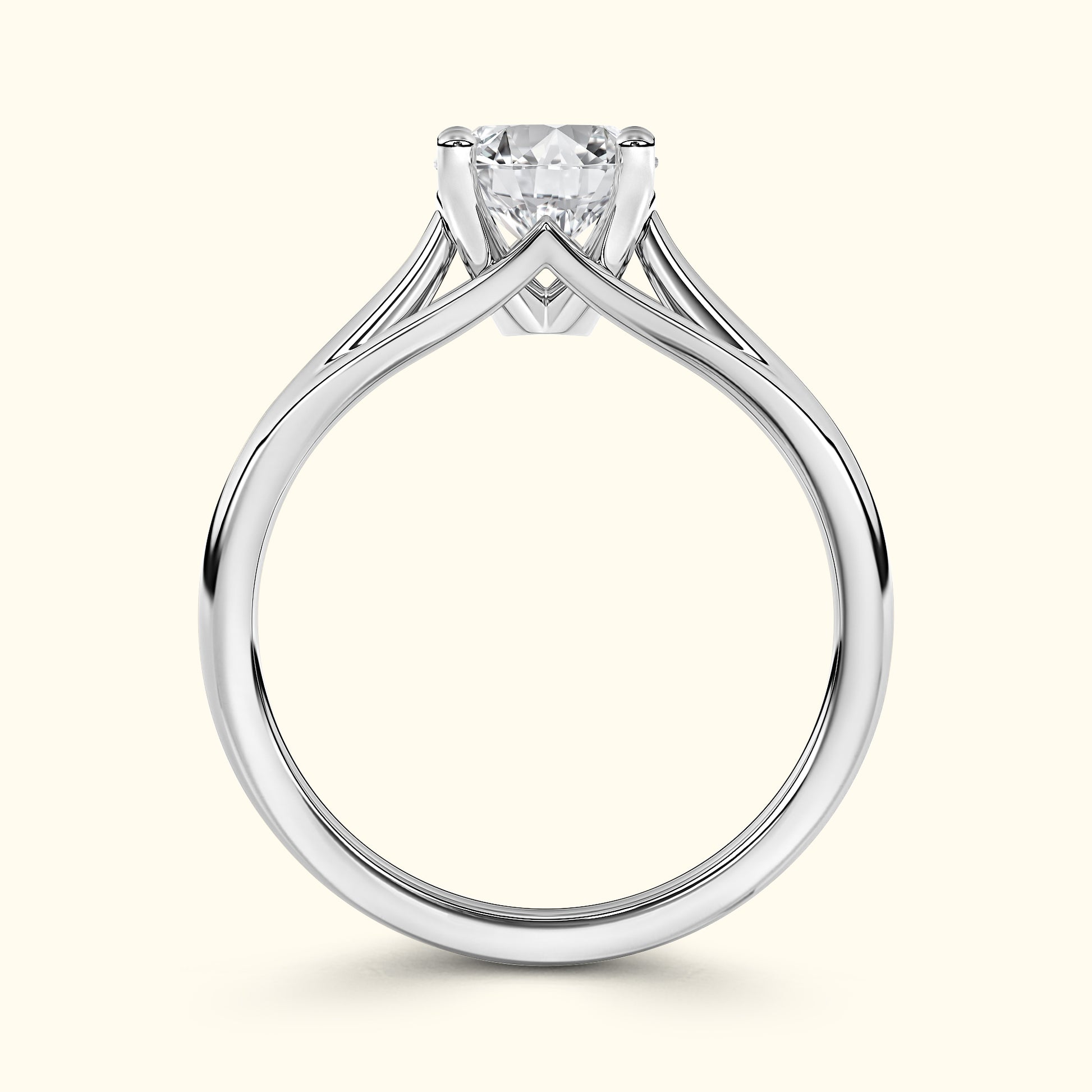 Elegant silver engagement ring with a prominent diamond, featuring a unique split shank design.