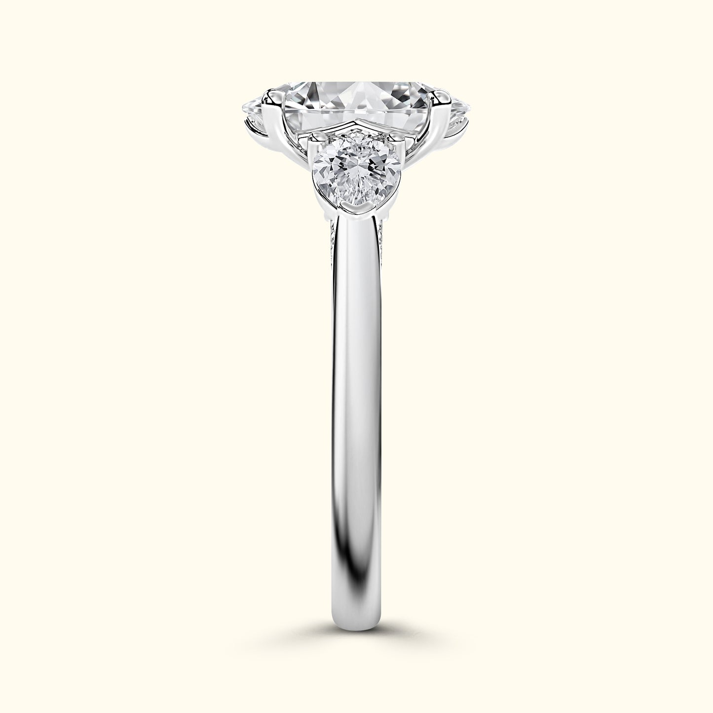 Elegant silver ring featuring a large central diamond with smaller stones on each side.