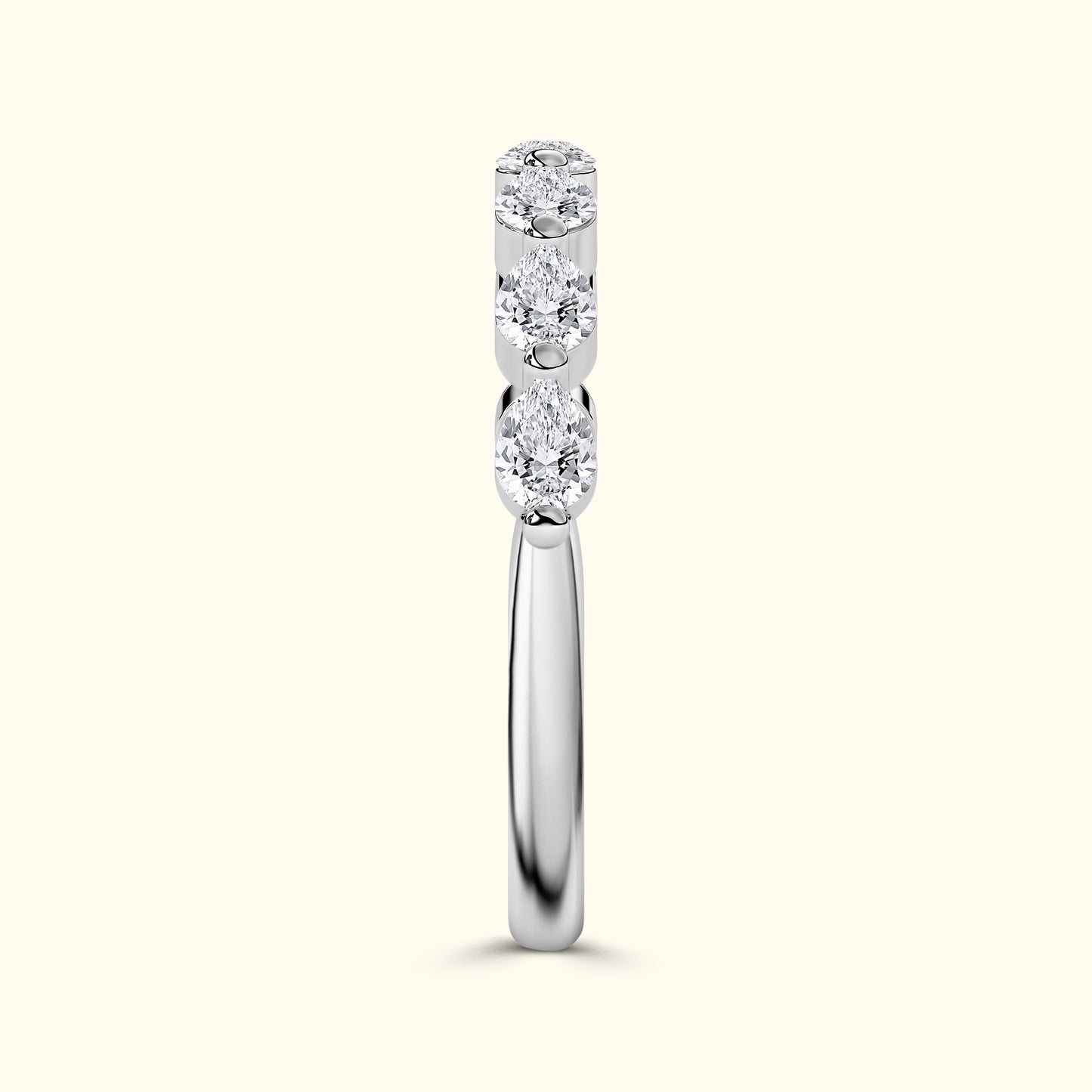 Sleek silver ring featuring three clustered diamonds on top.