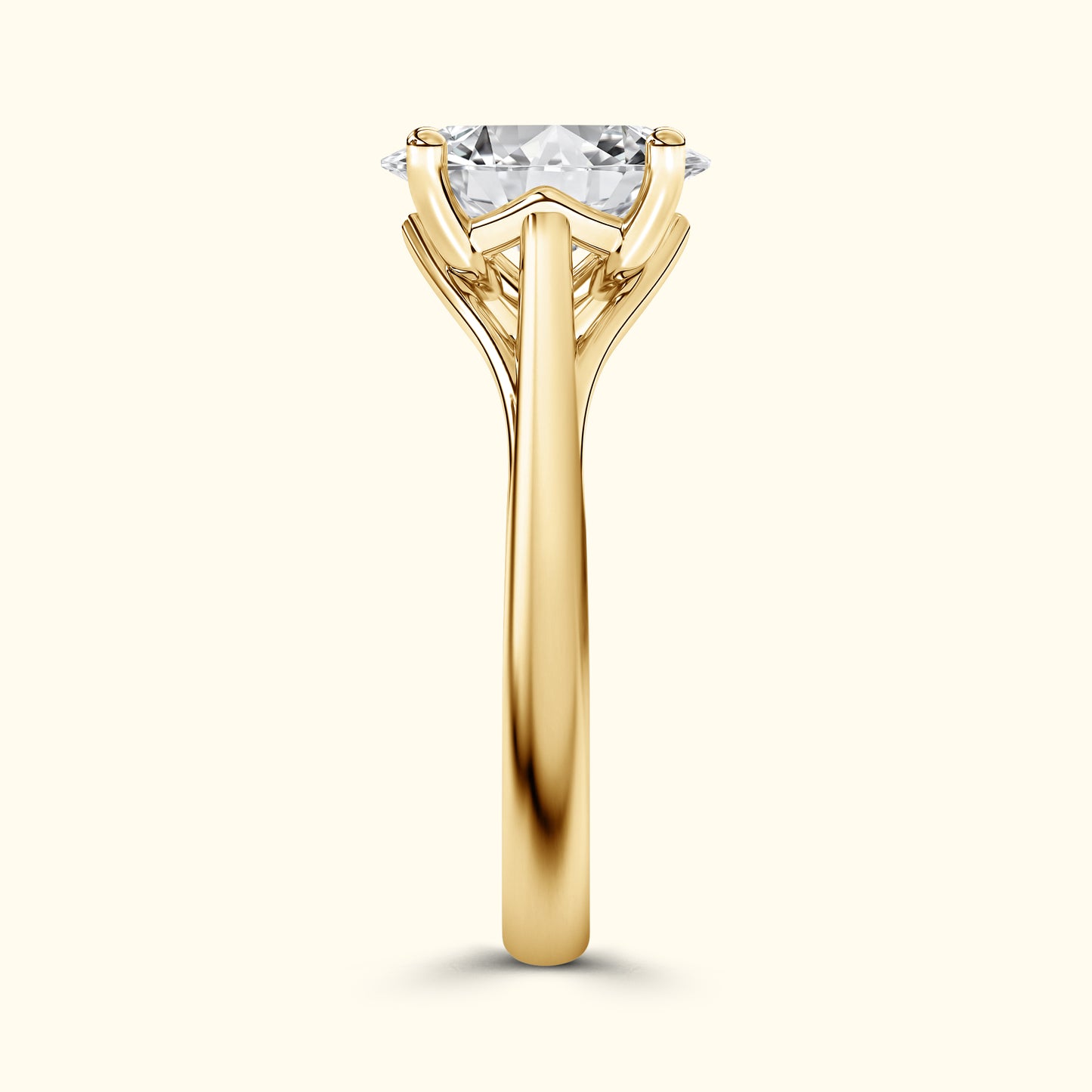 Solitaire engagement ring with a large diamond, set in a polished yellow gold band.