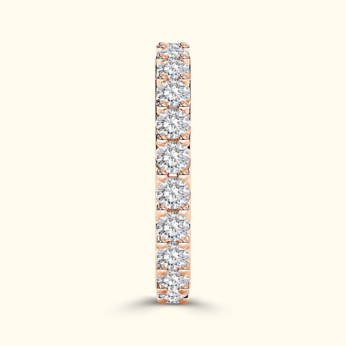 Rose gold band adorned with sparkling round diamonds.
