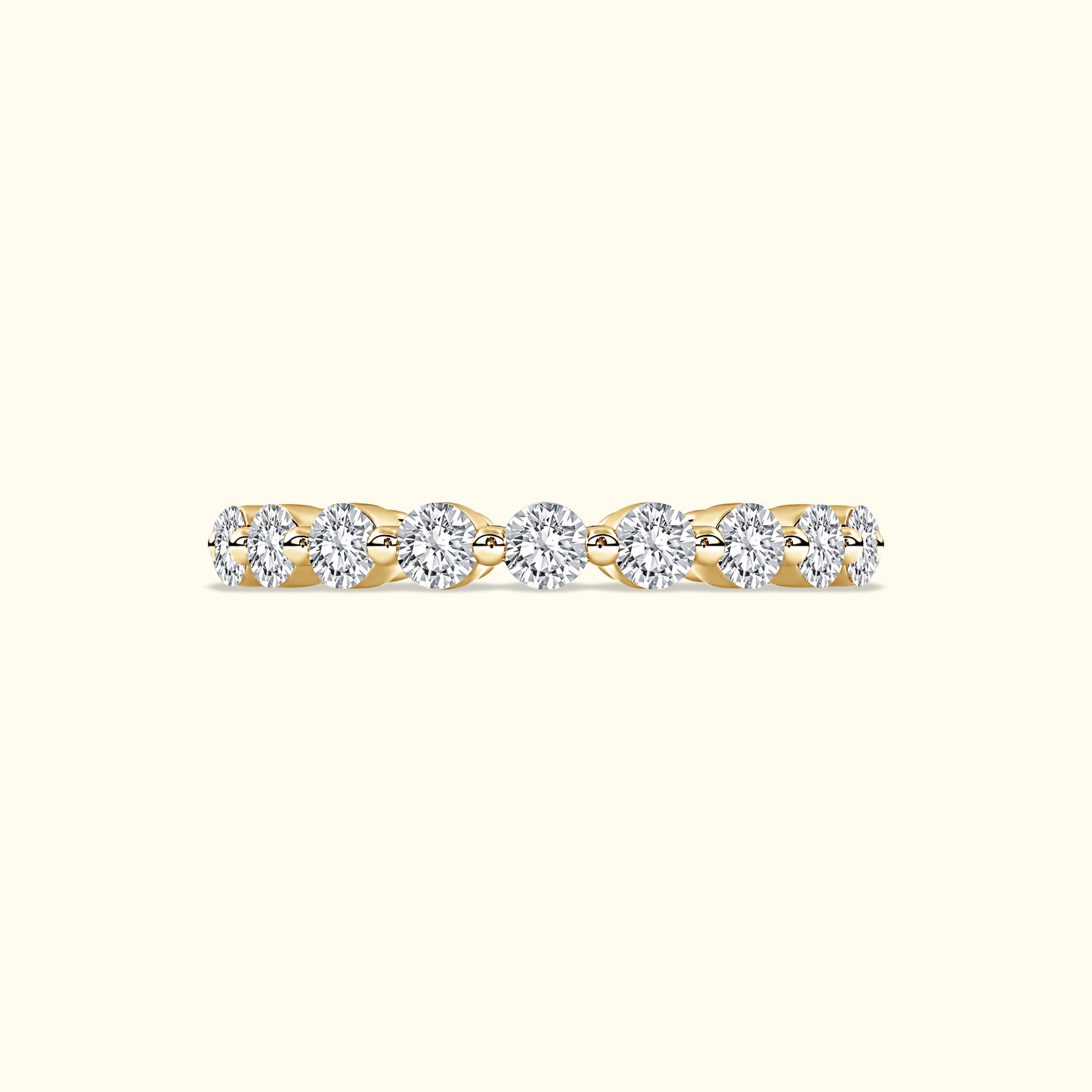 Delicate gold ring with a row of sparkling round diamonds.