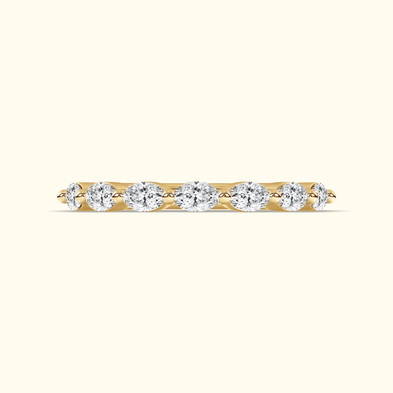 Yellow gold band with alternating round diamonds set in a row.