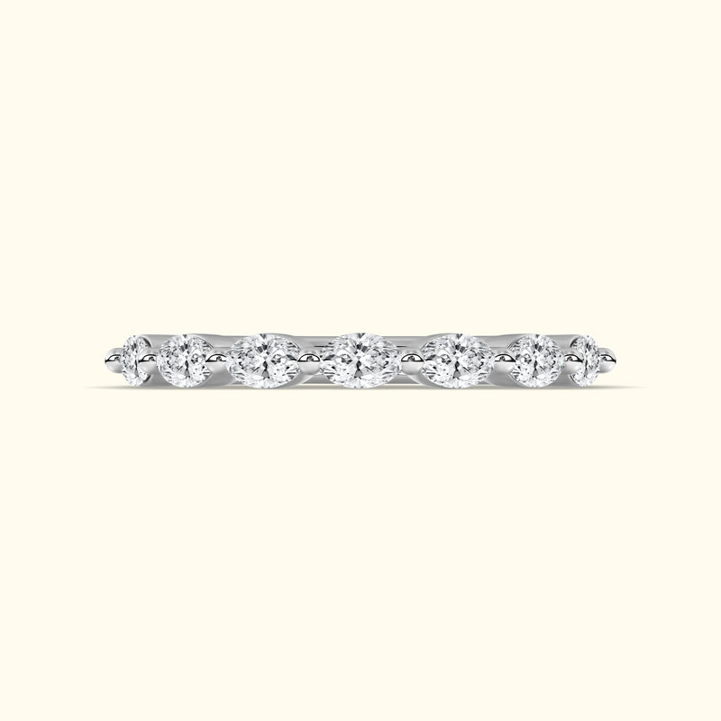 Elegant silver ring featuring a row of sparkling round diamonds.