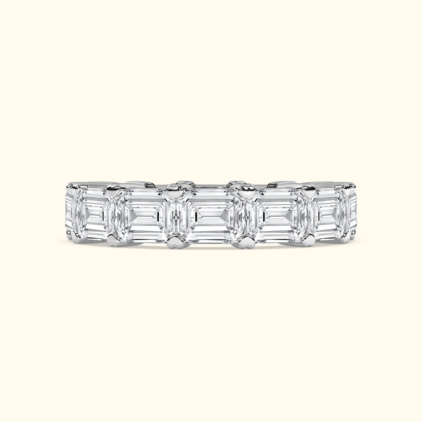 Elegant diamond band featuring an array of rectangular-cut diamonds set in a silver band.