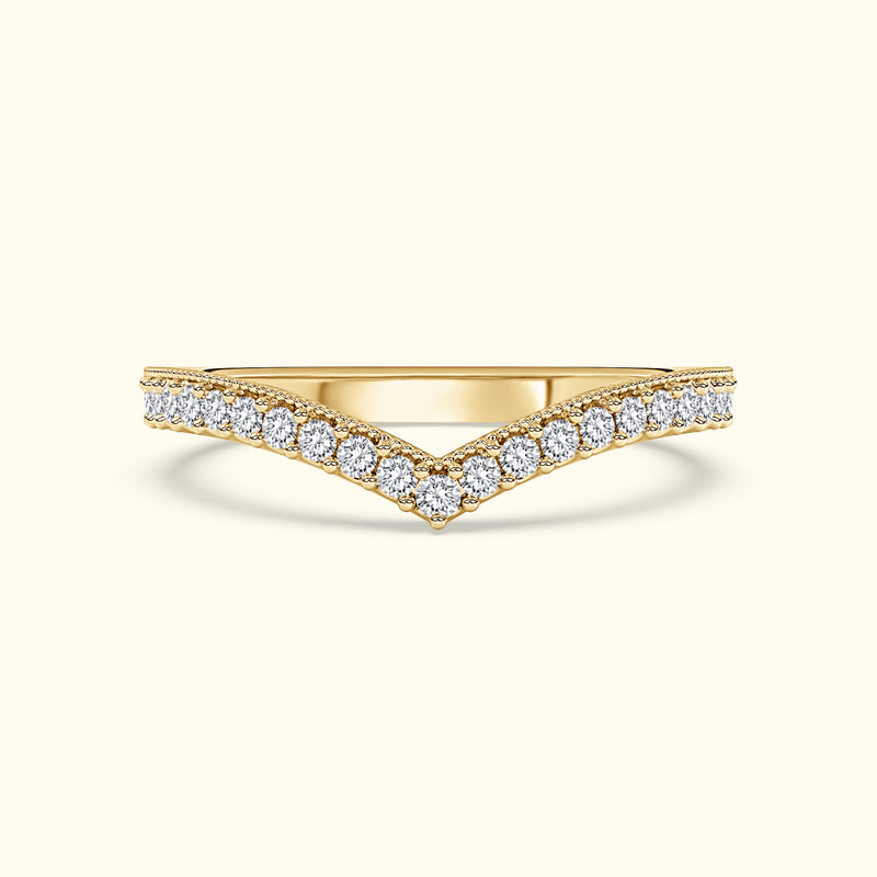 Elegant gold ring with a V-shape design, adorned with sparkling diamonds.