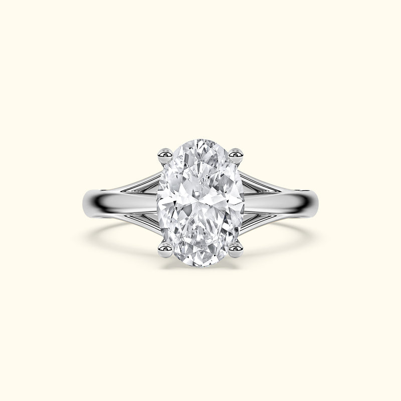 Elegant silver ring featuring an oval diamond center stone and sleek band design.
