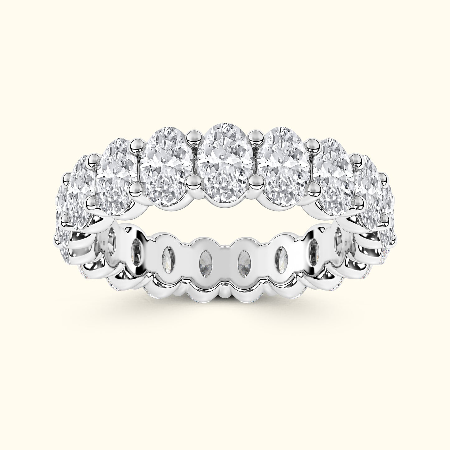 A silver band ring set with multiple oval-cut diamonds in a continuous circle.