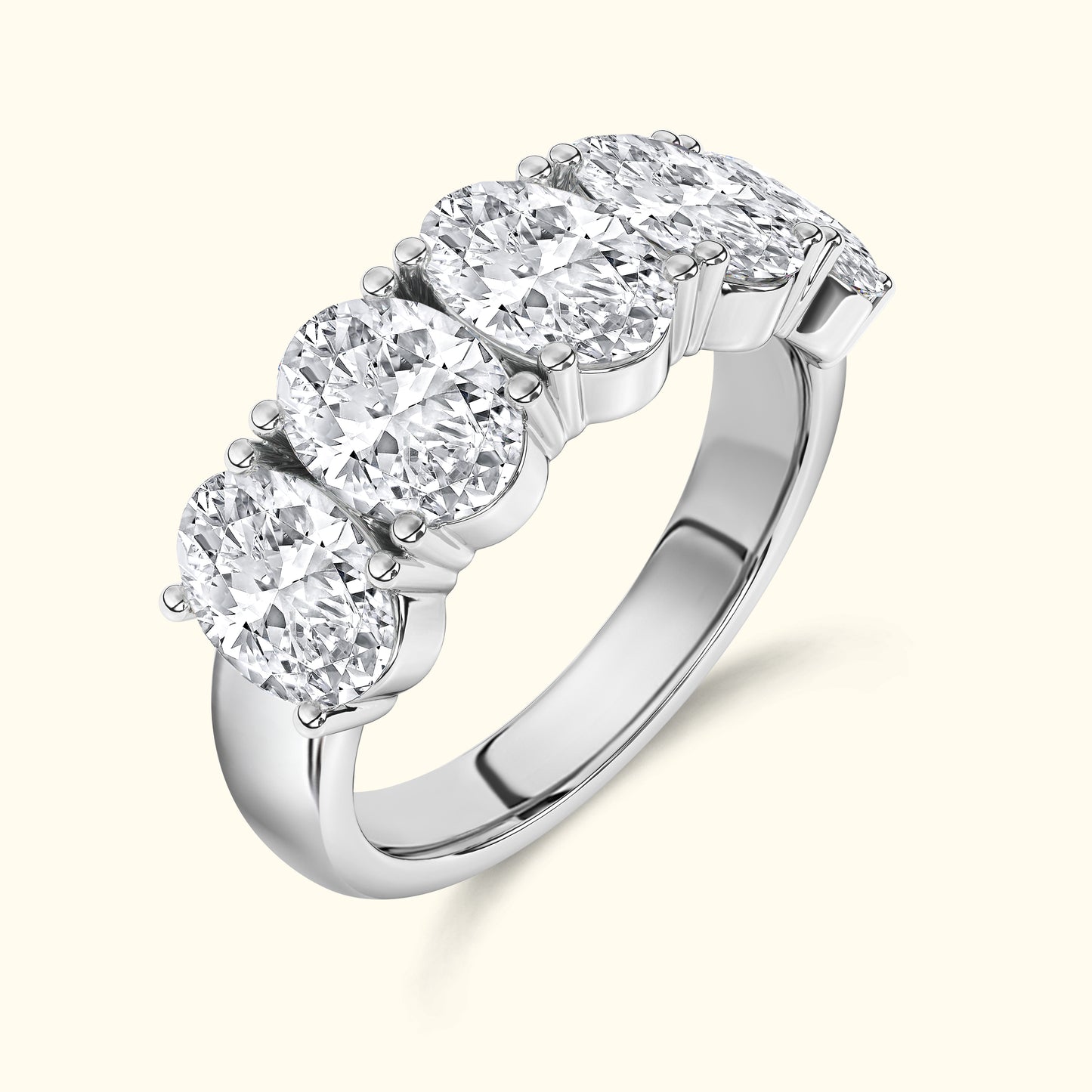 Five oval diamonds set in a sleek silver band, showcasing elegance and brilliance.