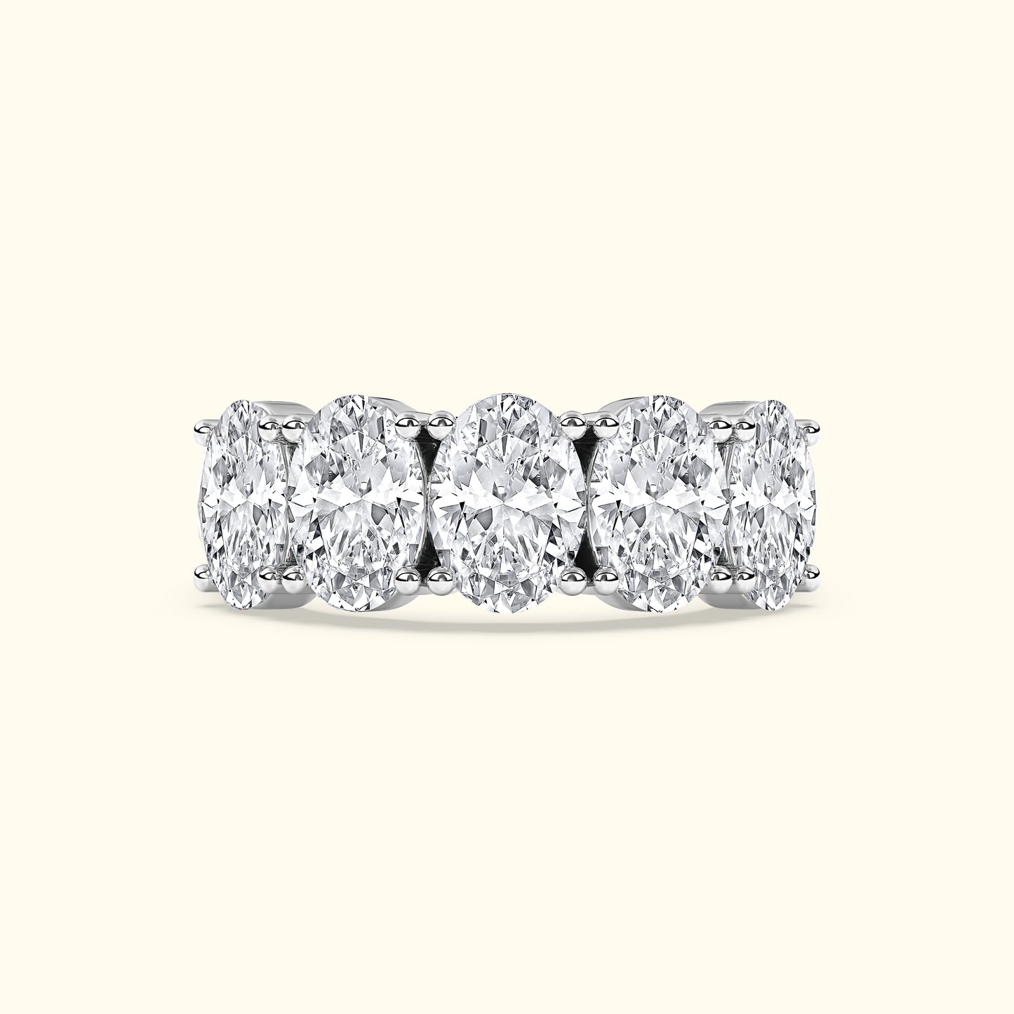 White gold band featuring five oval-cut diamonds in a row.