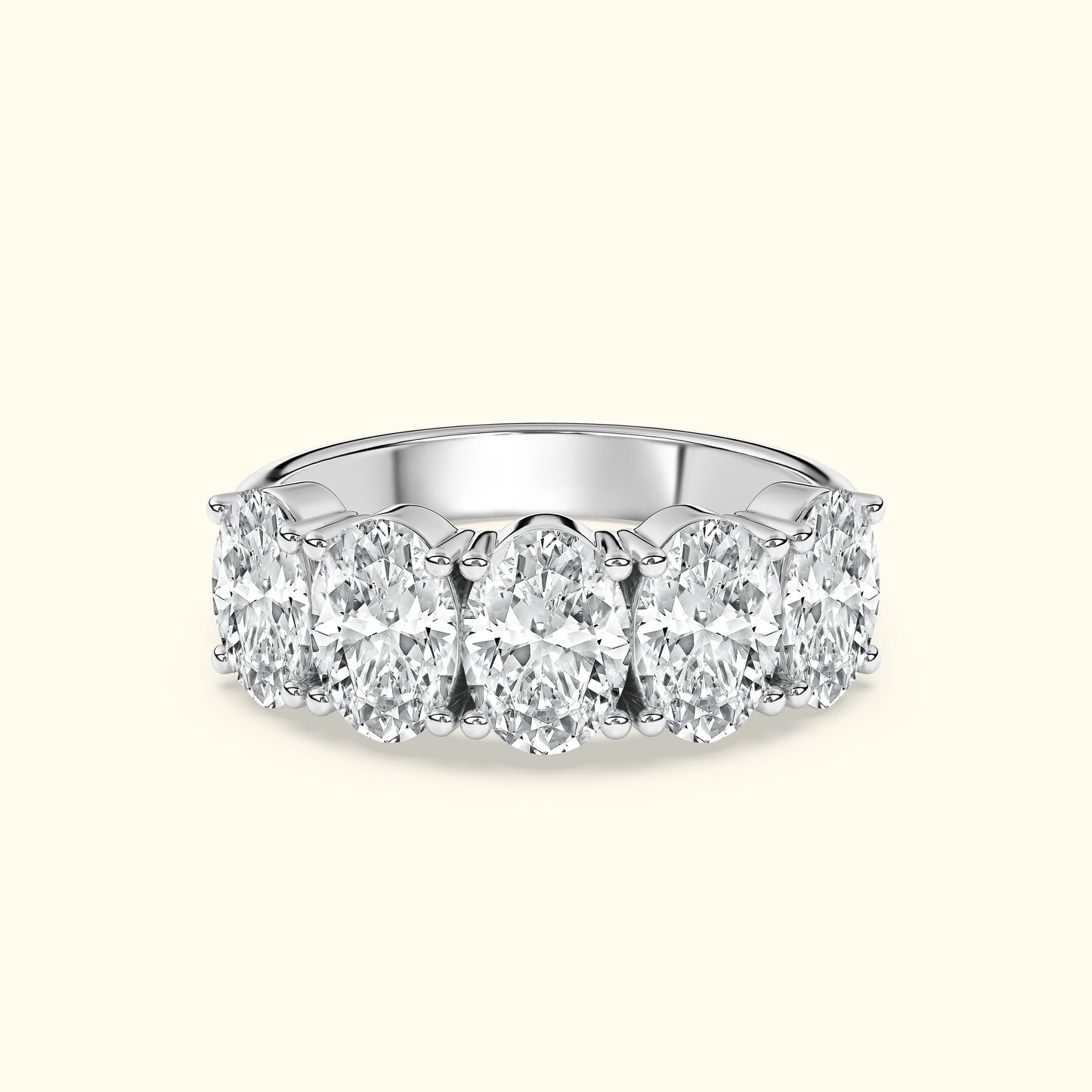 Oval diamond band ring with six sparkling gems set in white gold.