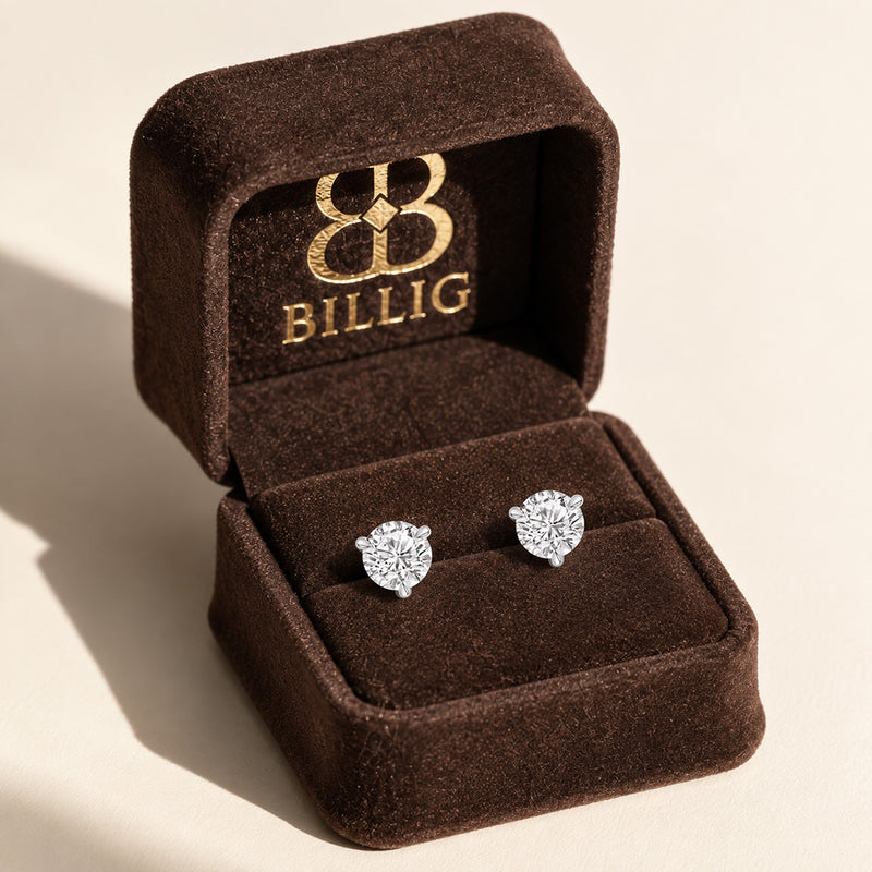 2.00 CTW round lab-grown diamond stud earrings in a signature three-prong martini-style 14kt white gold setting.