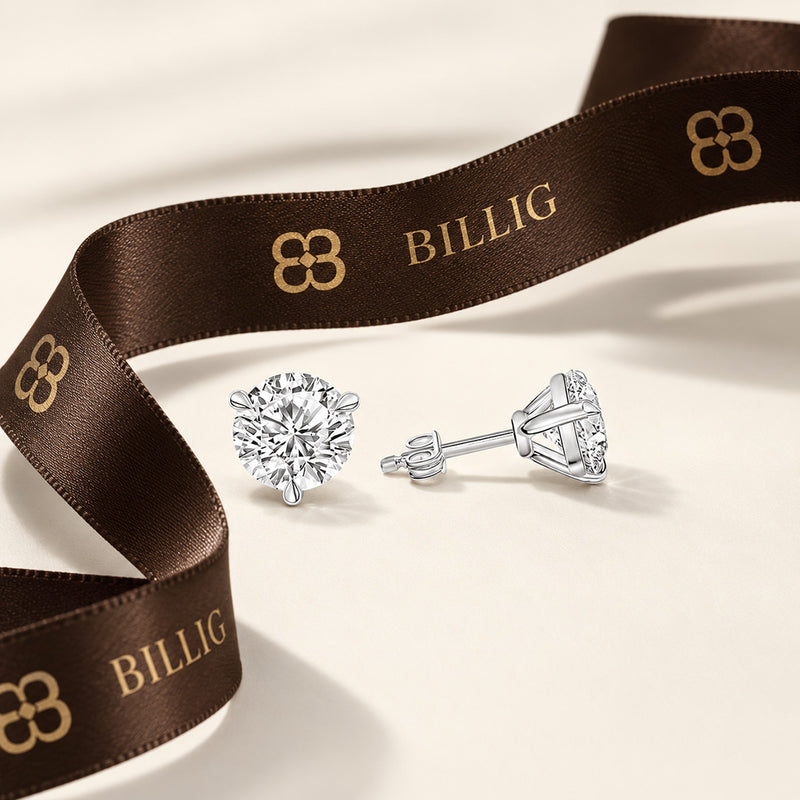2.00 CTW round lab-grown diamond stud earrings in a signature three-prong martini-style 14kt white gold setting.
