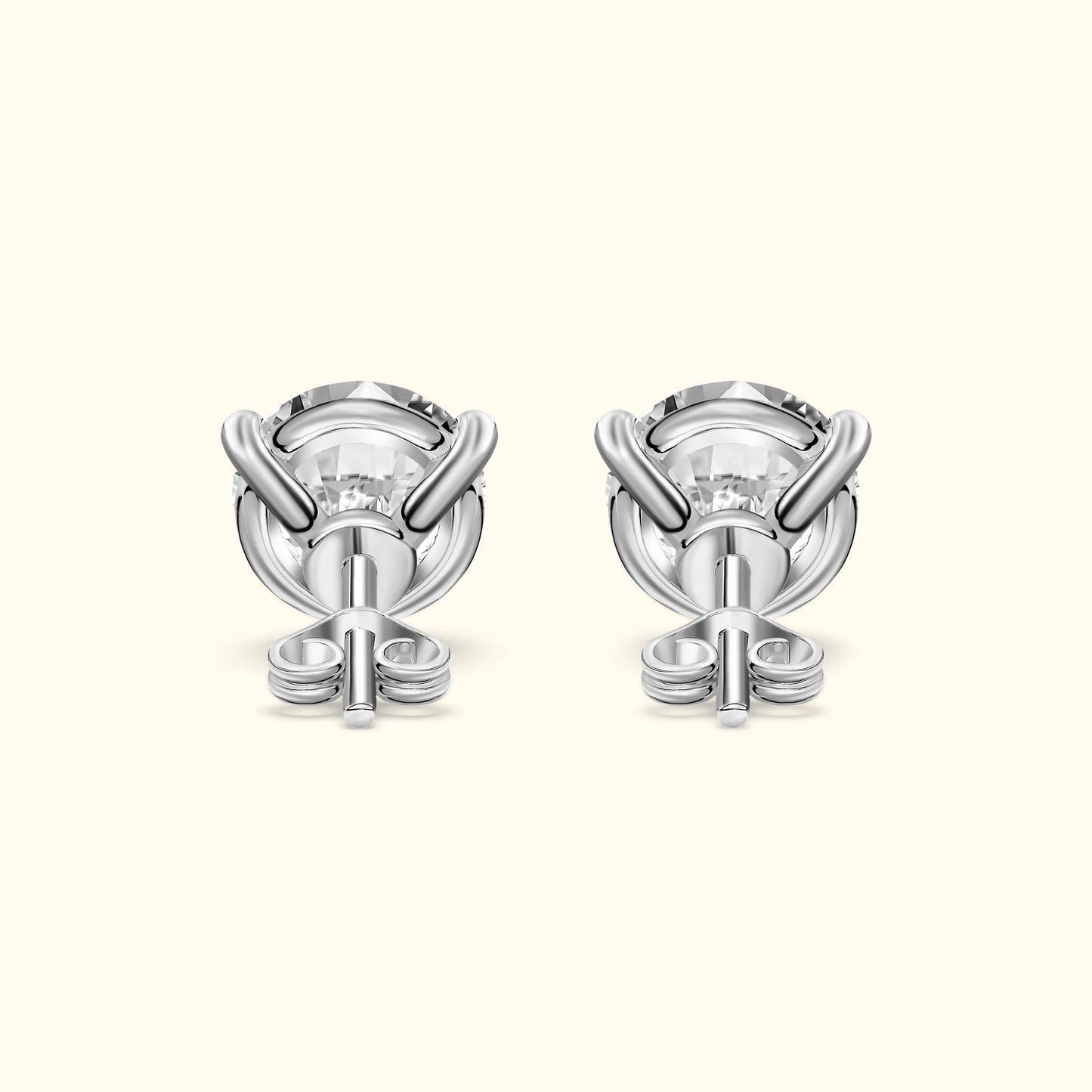 Elegant silver earrings with a modern design featuring clear gemstones at the center.