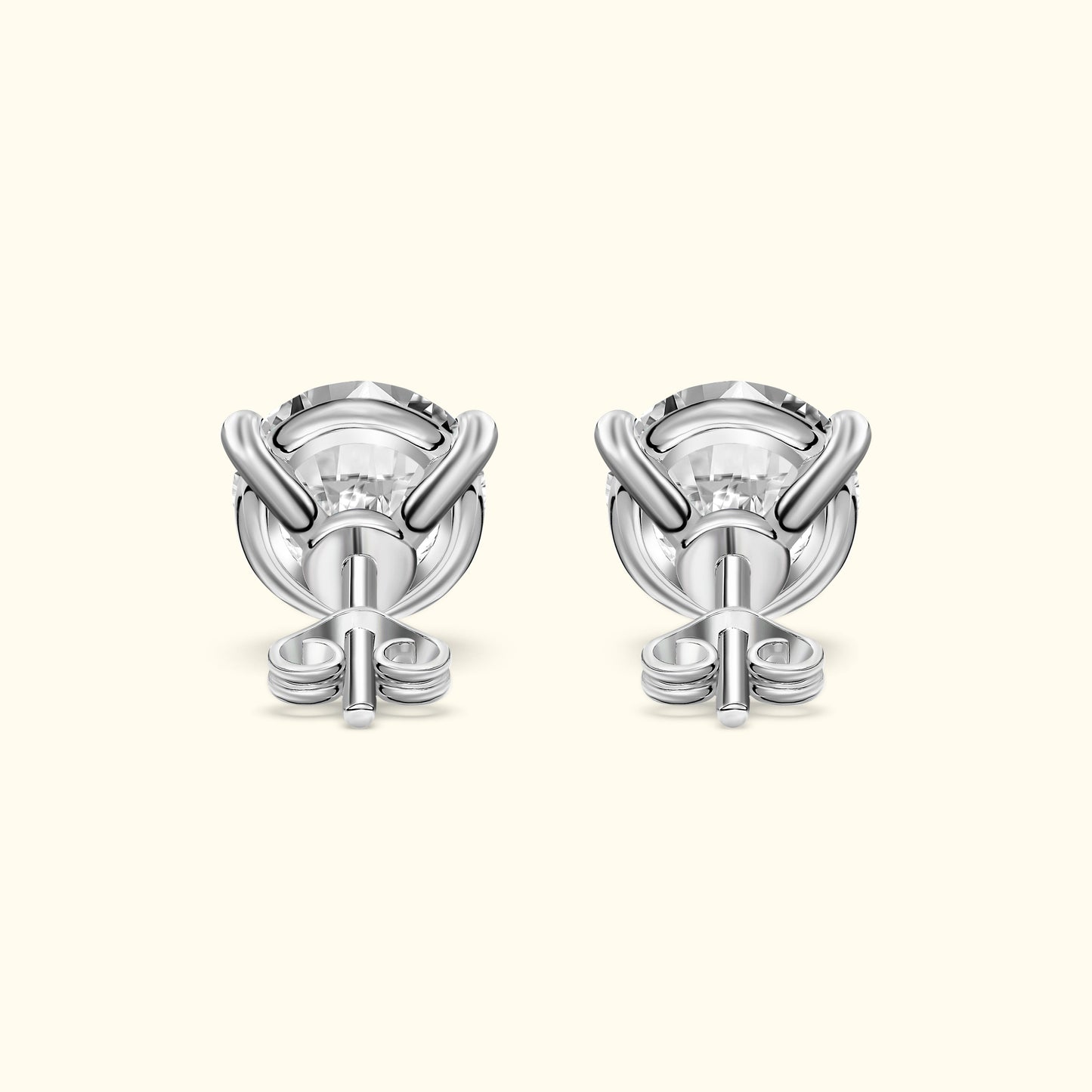 Elegant silver earrings featuring a unique twisted design and central clear gemstone.