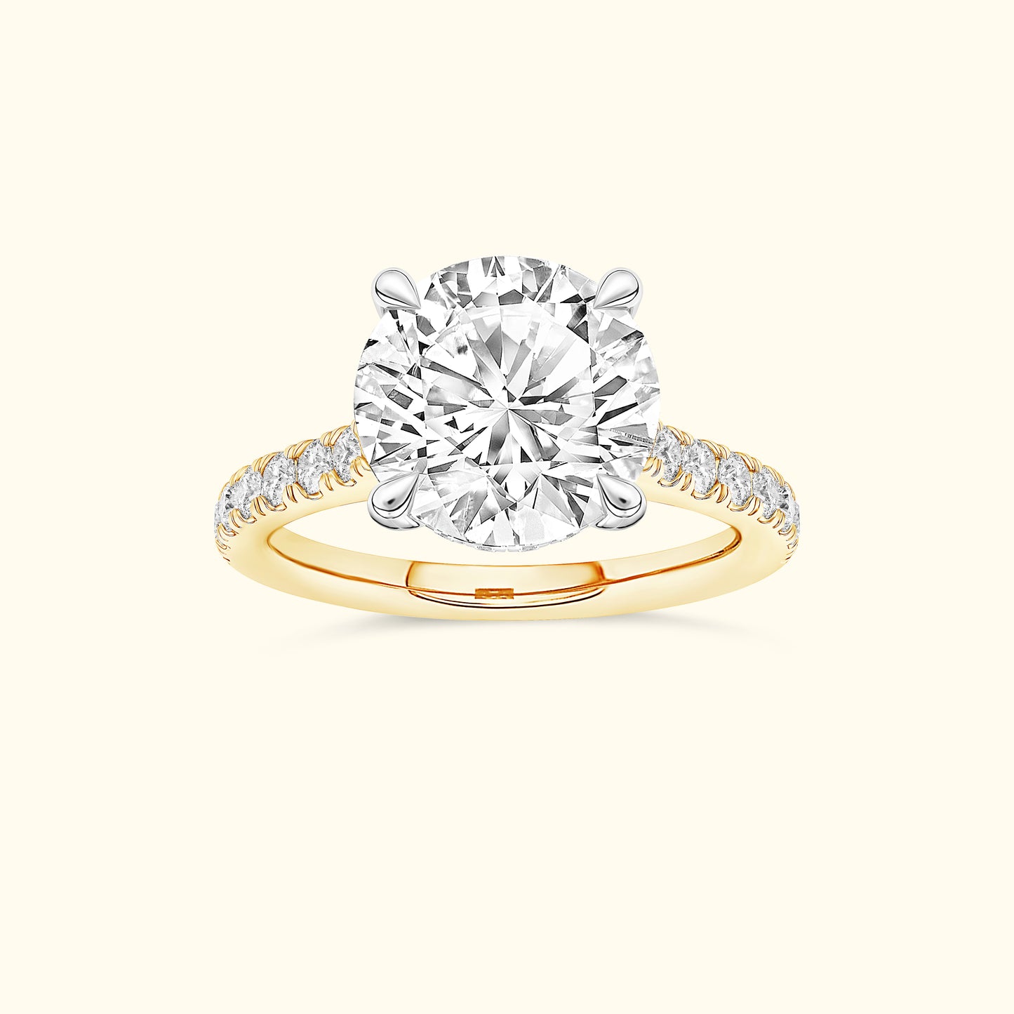 Round diamond engagement ring with a yellow gold band and sparkling side stones.