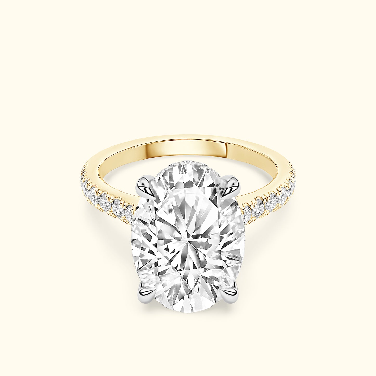 Oval diamond ring with a yellow gold band and smaller diamonds along the sides.