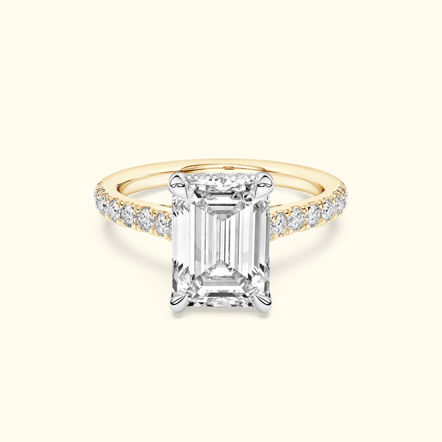 Elegant engagement ring featuring an emerald-cut diamond and a delicate band with smaller diamonds.