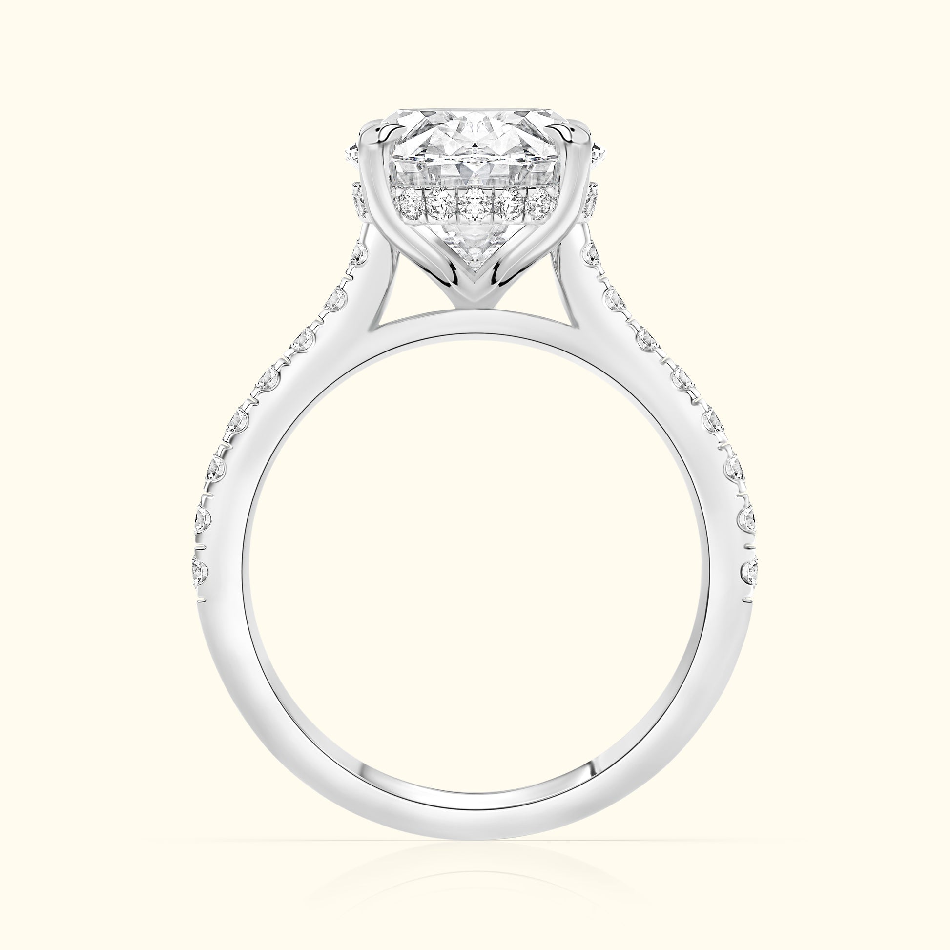 Elegant diamond engagement ring with a halo setting and sparkling side stones.