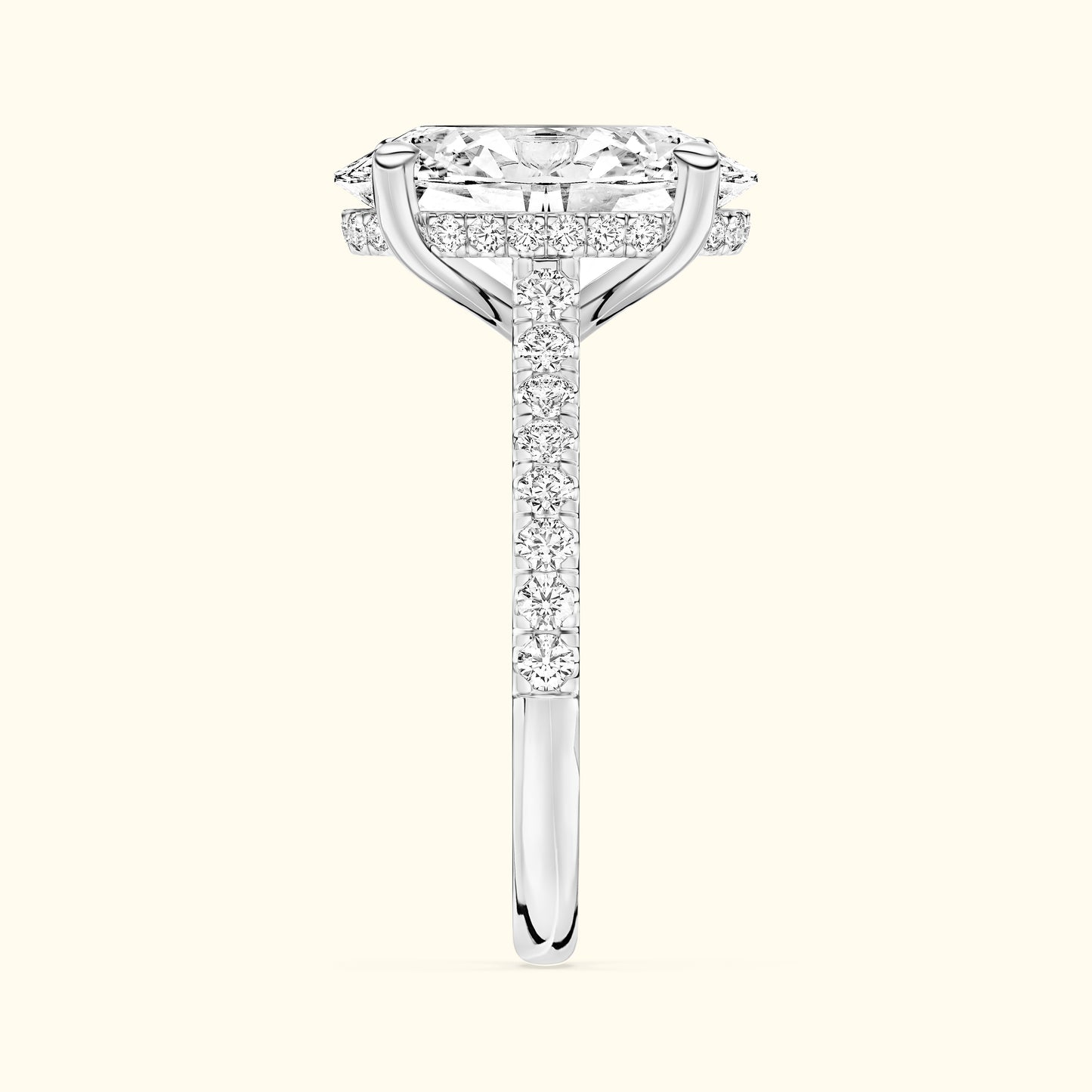 Elegant diamond engagement ring with a rectangular stone and a pavé band.