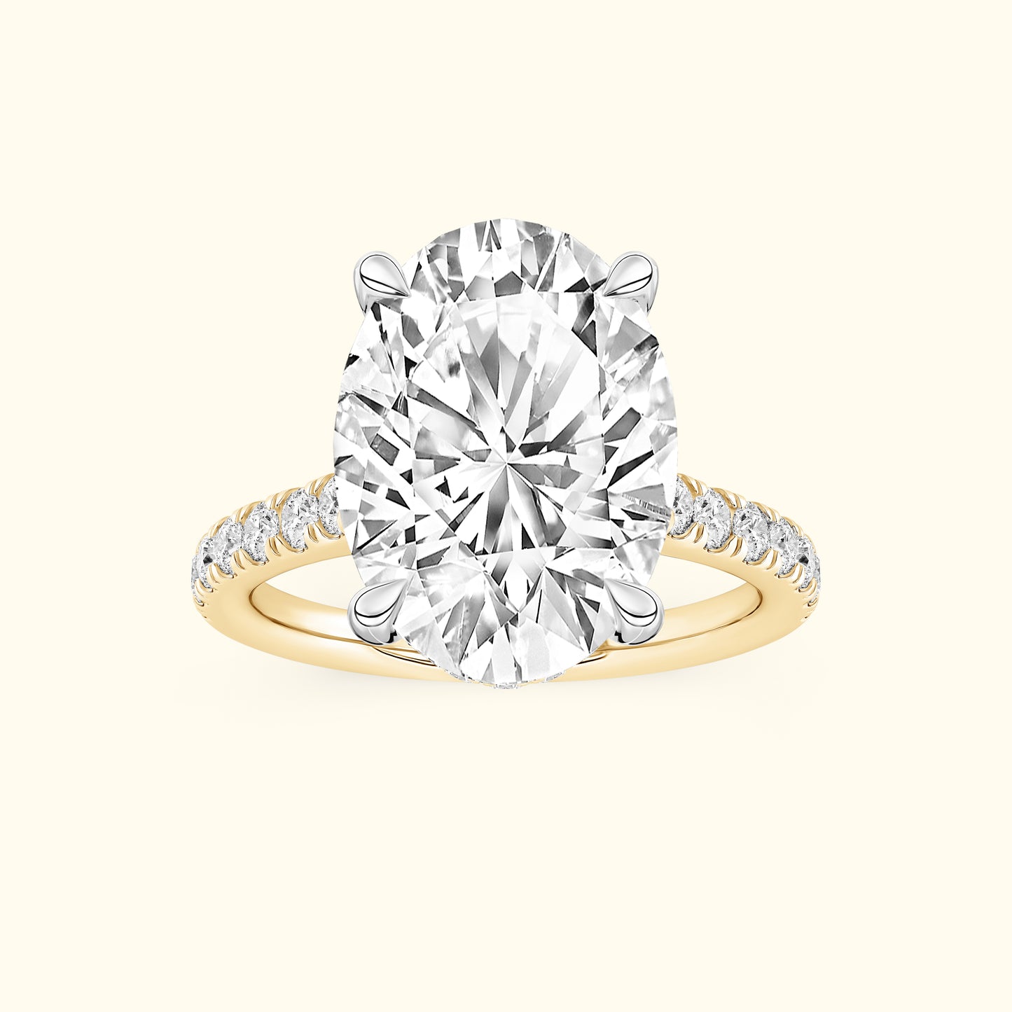 Oval diamond engagement ring with a gold band and smaller diamonds along the shank.